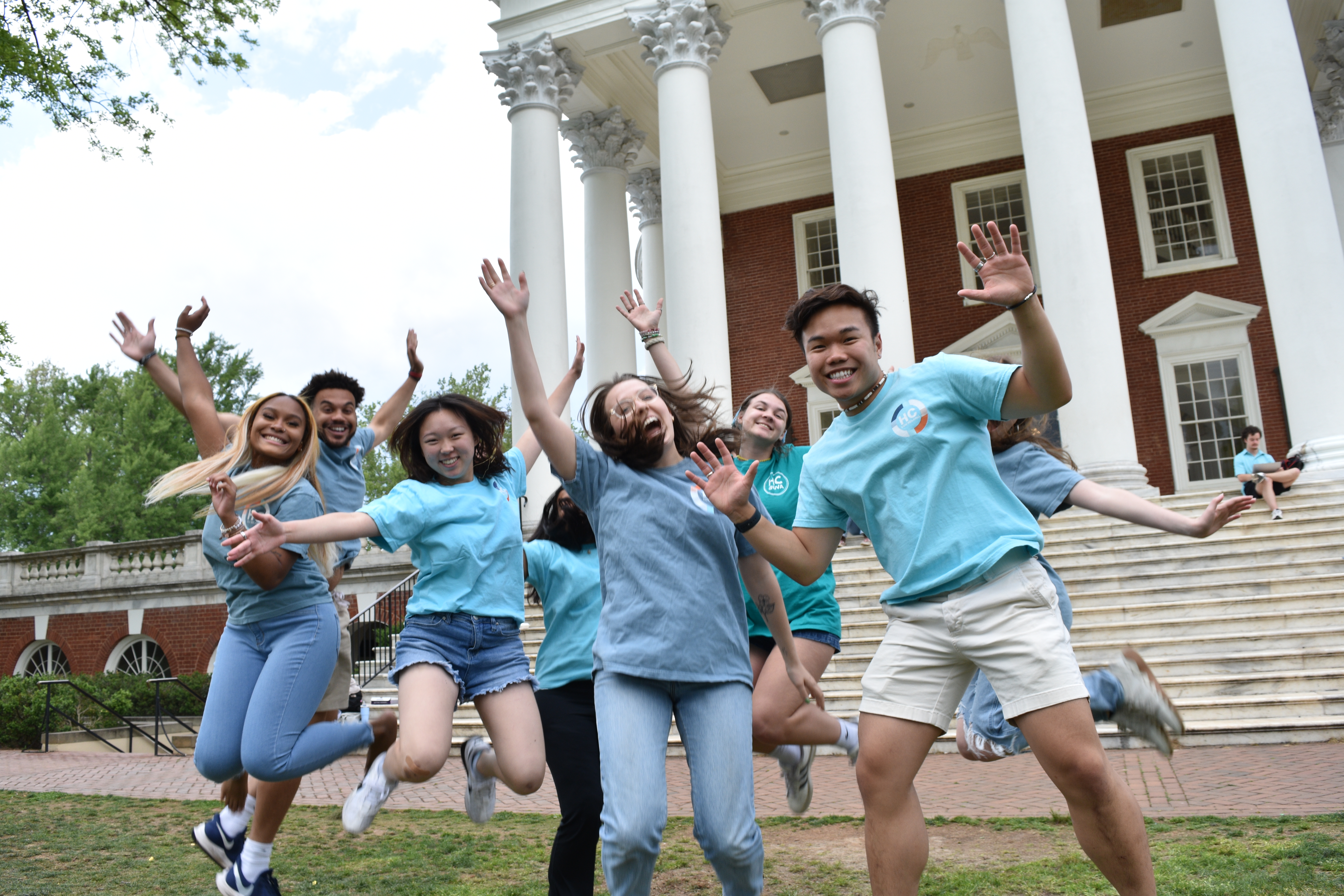 students jumping and laughing